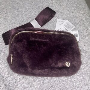 Lululemon Plush Belt Bag in Plum with gold